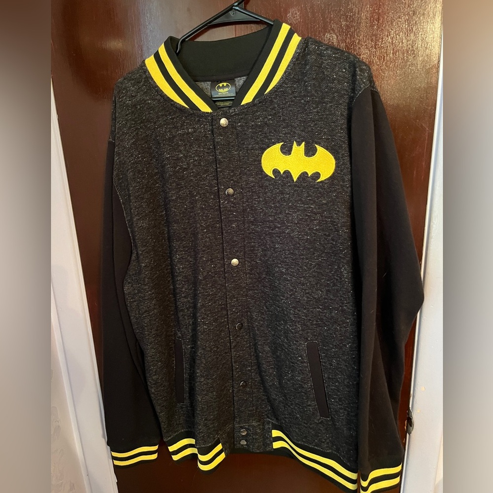 Batman sweater with snap down front, pockets and collar.  Black& yellow large